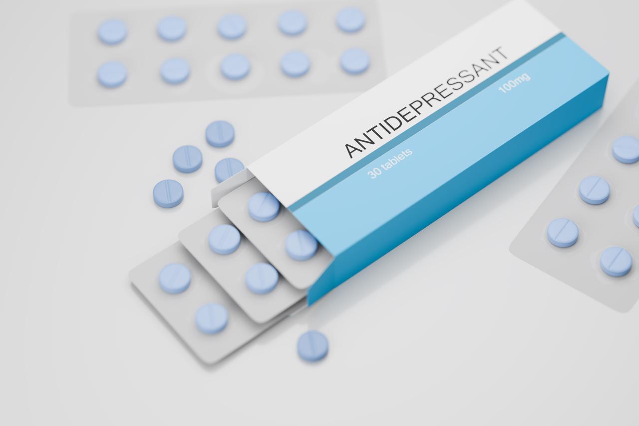 Antidepressant medicine scattered on white table, blue pills in box, accessed on Aug. 12, 2025. (Adobe Stock Photo)