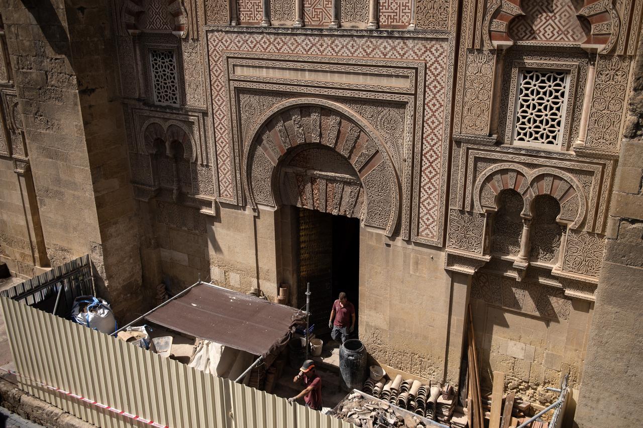 Employees work in the historic mosque-cathedral of Cordoba after a fire broke out the previous day in the monument, in Cordoba southern Spain, August 9, 2025. (AFP Photo)