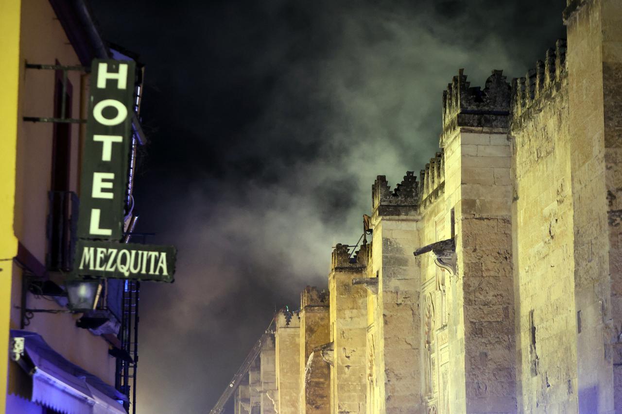 Smoke rises after a fire broke out in the historic mosque-turned-cathedral in the southern Spanish city of Cordoba, August 8, 2025. (AFP Photo)