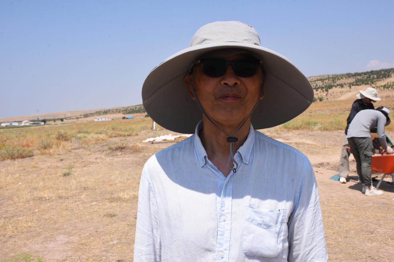 Japanese archaeologist Professor Satoshi Urano (pictured), who joined the Uc Hoyuk excavations in Türkiye’s Bolvadin district of Afyonkarahisar in the hope of finding the lost city of Purushanda, speaks to an Anadolu Agency reporter, August 11, 2025. (AA Photo)