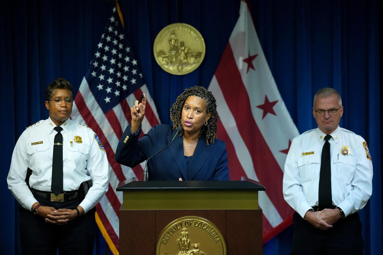 Washington, DC Mayor Muriel Bowser (C), joined by Chief of Police at the Metropolitan Police Department Pamela Smith (L) and Fire and Emergency Medical Services Chief Chief John Donnelly, speaks at a press conference after President Donald Trump announced a federal takeover of the Metropolitan Police Department at the Wilson Building on August 11, 2025. (AFP Photo)