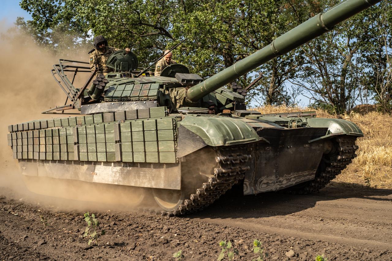 Ukrainian soldiers service their tanks and armored vehicles in the Kherson region, Ukraine on August 8, 2025. (AA Photo)