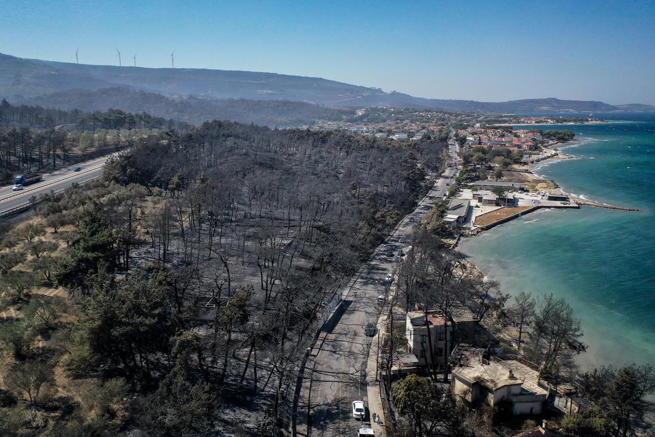 An aerial view of Kepez district after the wildfire that erupted and spread across, as firefighting efforts continue in Canakkale, Turkiye on August 12, 2025. (AA Photo)