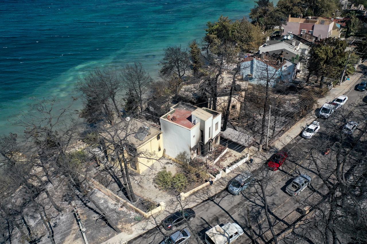 An aerial view of Kepez district after the wildfire that erupted and spread across, as firefighting efforts continue in Canakkale, Turkiye on August 12, 2025. (AA Photo)