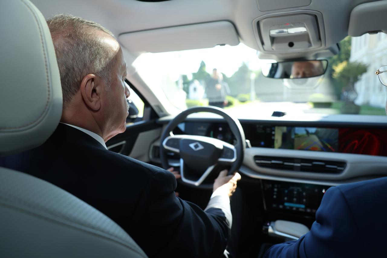 President Recep Tayyip Erdogan drives a Togg vehicle in Istanbul, Türkiye, July 5, 2025. (IHA Photo)