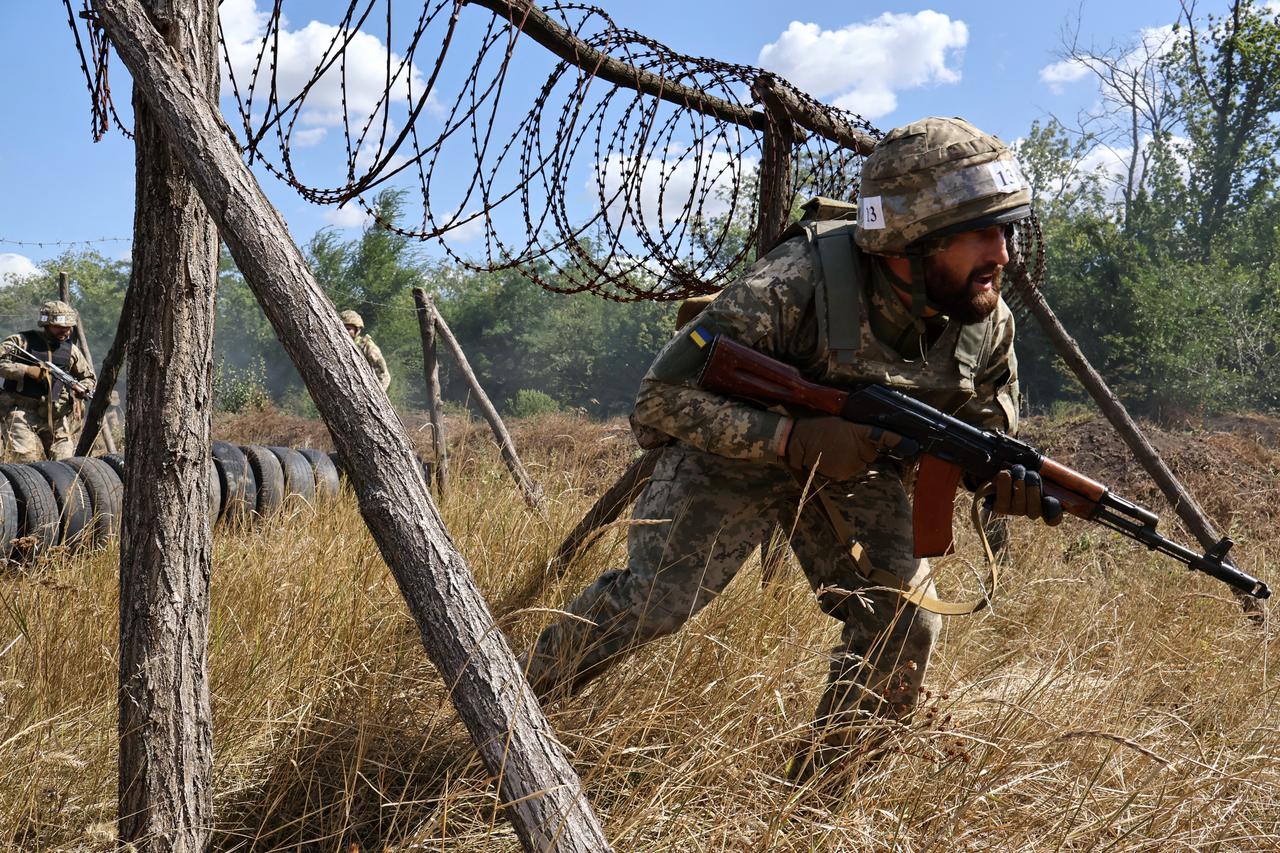 Ukrainian recruits taking part in a training exercise at an undisclosed location in Zaporizhzhia region on August 13, 2025. (Photo by Andriy Andriyenko/65th Mechanized Brigade of Ukrainian Armed Forces/AFP)