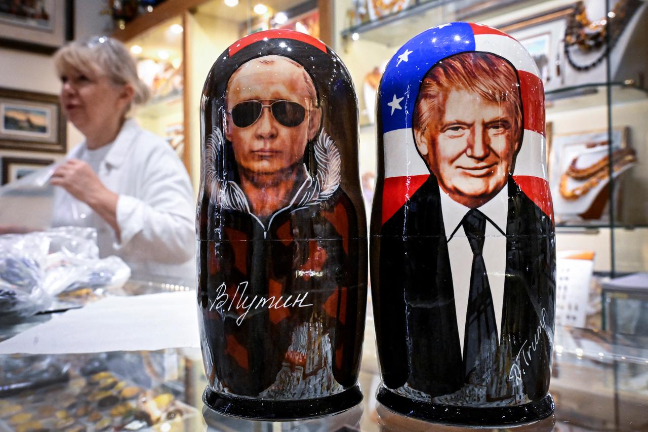 Traditional Russian wooden nesting dolls, Matryoshka dolls, depicting Russian President Vladimir Putin and US President Donald Trump are displayed in downtown Moscow on August 13, 2025. (AFP Photo)