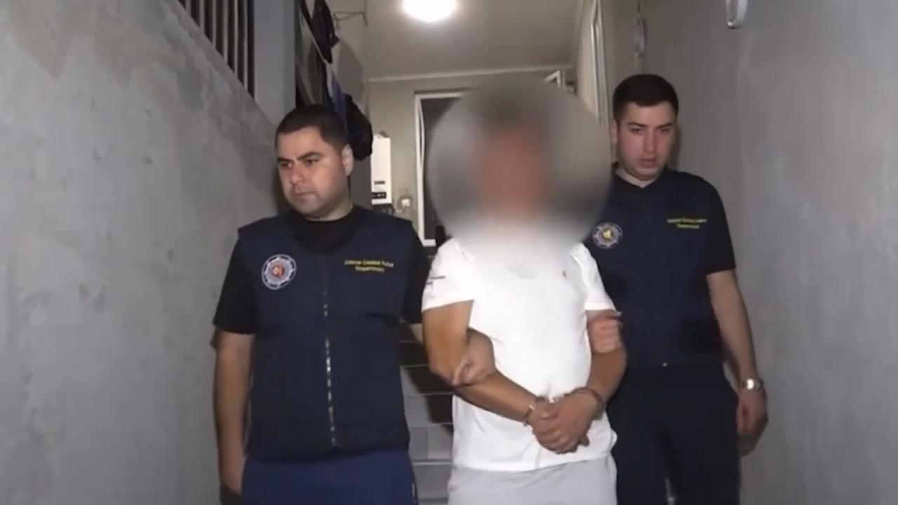 Georgian police officers escort criminals in Georgia in joint operation in Georgia on August, 2025. (Photo via Turkish Interior Ministry)