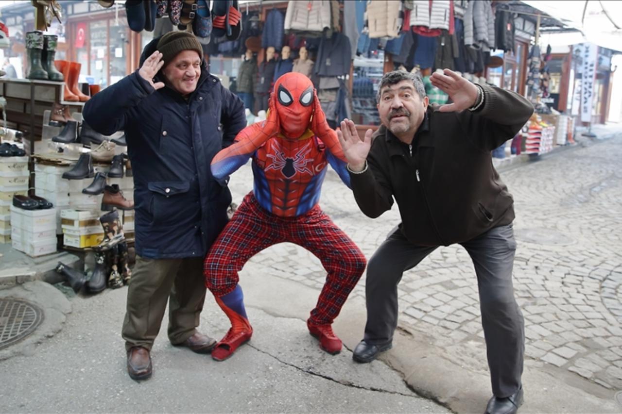The “Spider-Man” traveling across Türkiye meets with residents in Corum, January 23, 2025. (AA Photo)