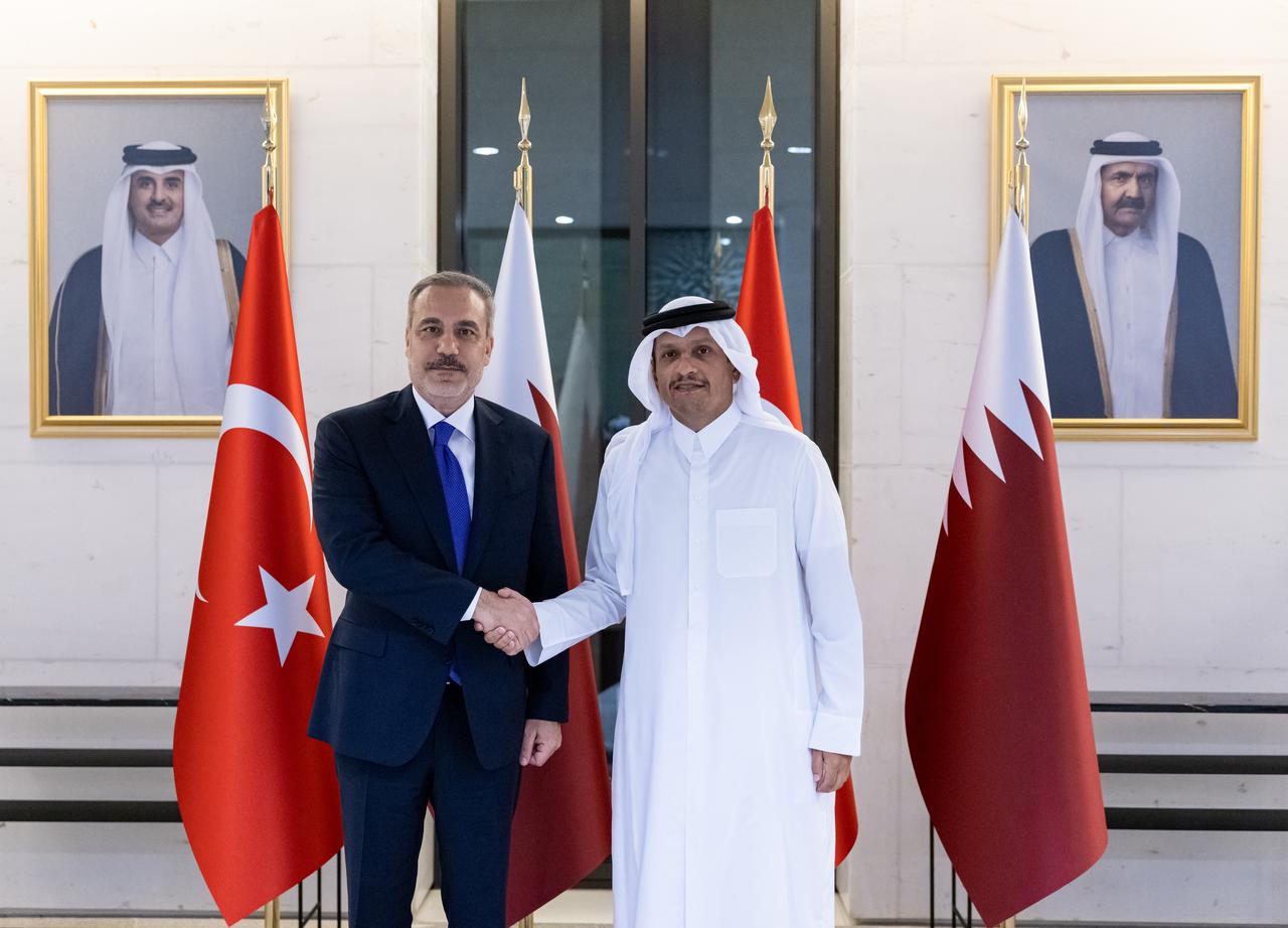 Foreign Minister Hakan Fidan (L) meets with Qatari Prime Minister and Foreign Minister Mohammed bin Abdulrahman Al Thani (R) in Doha, Qatar on August 13, 2025. (AA Photo)