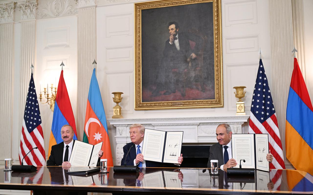 U.S. President Donald Trump (C), Azerbaijani President Ilham Aliyev (L), and Armenian Prime Minister Nikol Pashinyan (R) sign the joint declaration "peace roadmap" in Washington D.C., United States on August 08, 2025. (Photo via Azerbaijan Presidency)