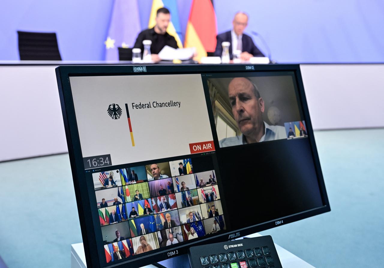A screen is seen in front of Ukrainian President Volodymyr Zelenskyy (back L) and German Chancellor Friedrich Merz (back R) attend a video conference of European leaders with the US President on August 13, 2025. (AFP Photo)