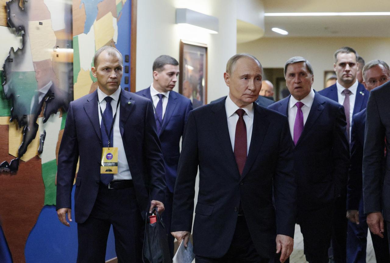 Russian President Vladimir Putin (C) is seen after a joint press conference following a US-Russia summit on Ukraine in Anchorage, Alaska, on August 15, 2025. (AFP Photo)