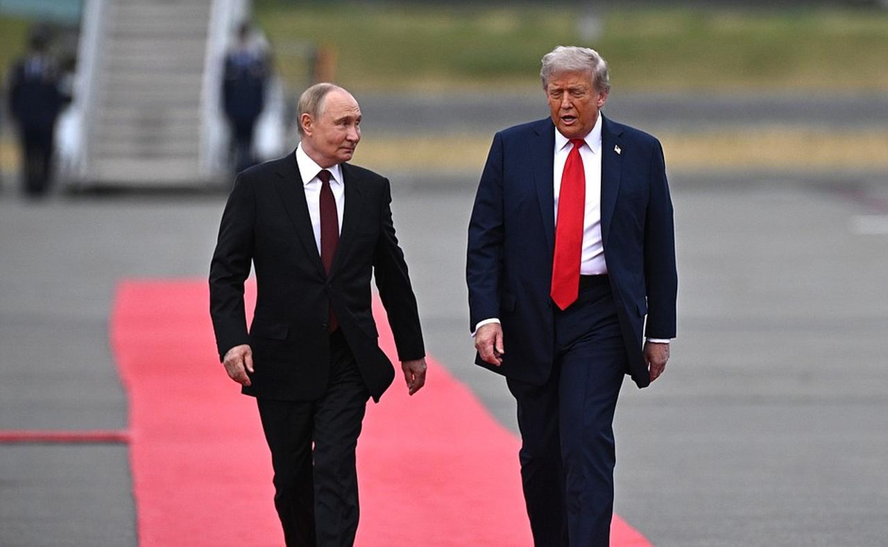 President Donald Trump meets his Russian counterpart, Vladimir Putin on the tarmac in a red-carpet greeting in Anchorage, Alaska, United States on August 15, 2025. (Photo via Kremlin Press Office)