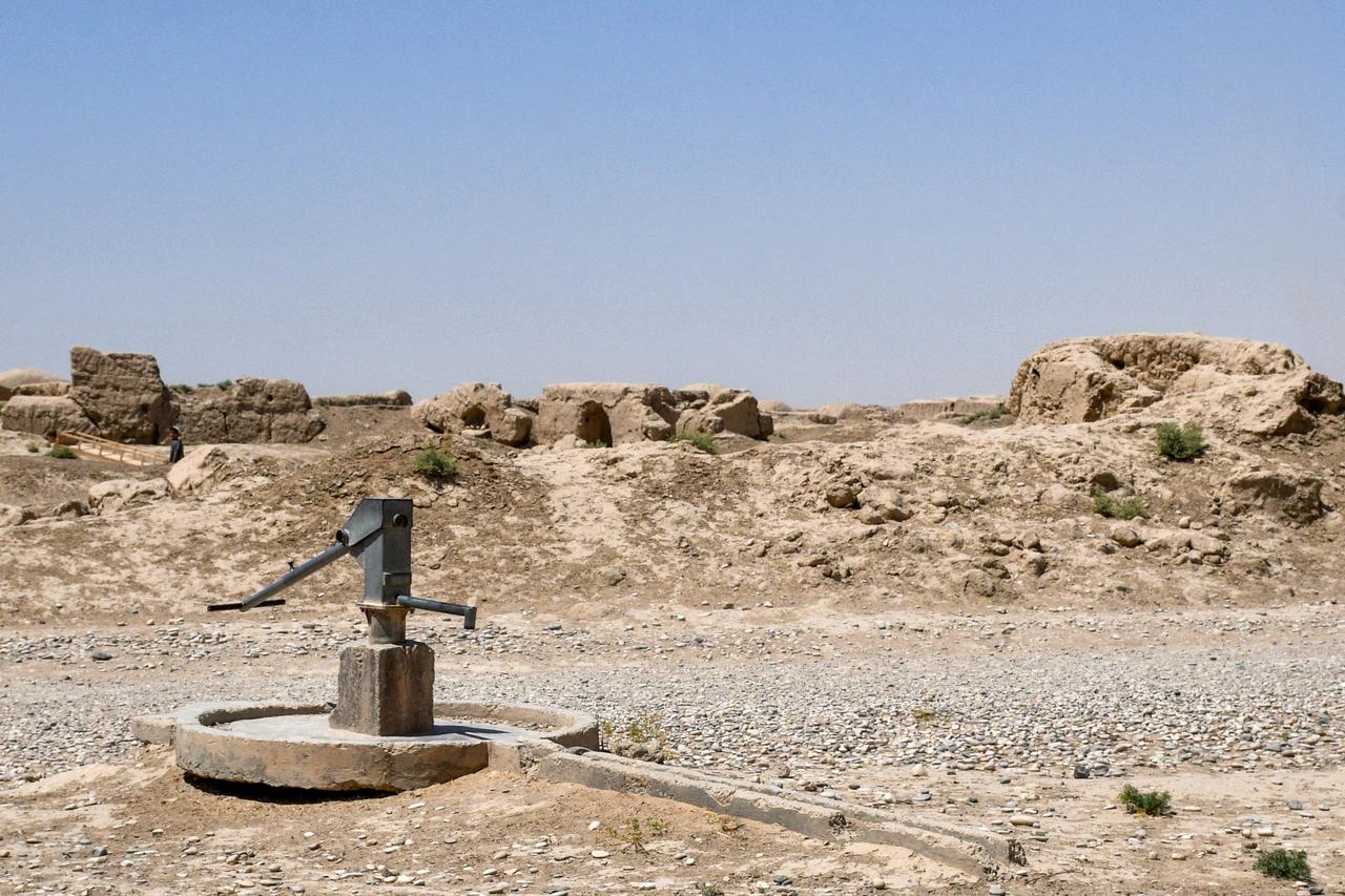 A hand pump near dilapidated dome-shaped traditional Afghan houses on a deserted street in a village in Balkh province, Afghanistan, July 10, 2025. (AFP Photo)
