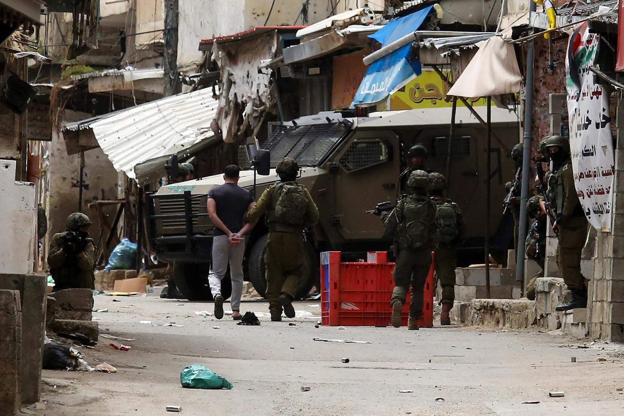 Israeli army detains and blindfolds some Palestinians during a raid on Balata refugee camp in Nablus, West Bank, April 9, 2025. (AA Photo)
