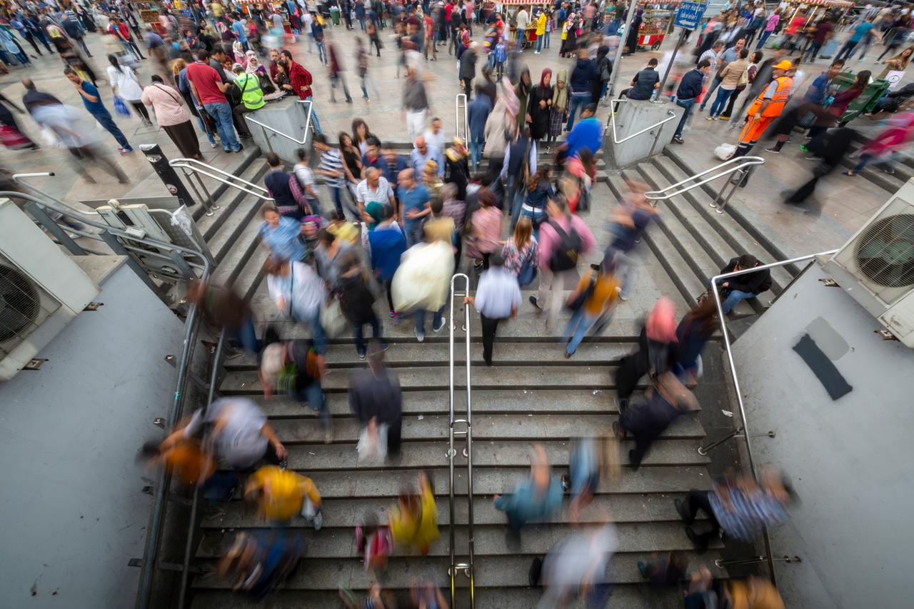 People walk through a busy underpass in Istanbul, Türkiye. (Adobe Stock Photo)