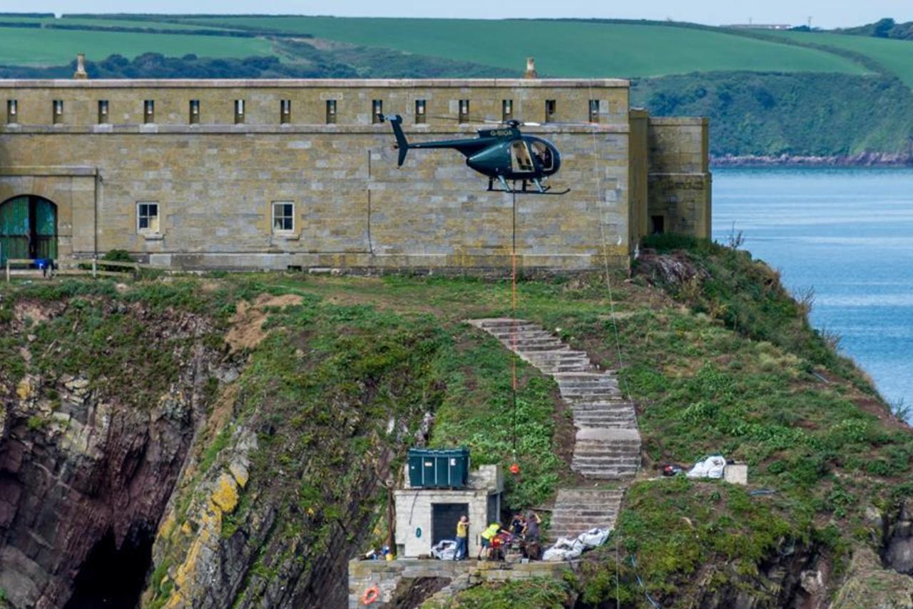 Helicopters move building supplies in to Thorne Island near Milford Haven. (Photo via Hidden Pembrokeshire)