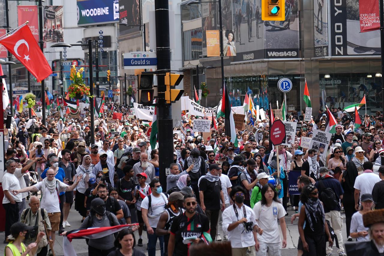 Hundreds of people march in downtown Toronto to protest Israeli actions and to call for an end to the starvation in Gaza on August 16, 2025 in Ontario, Canada. (AA Photo)