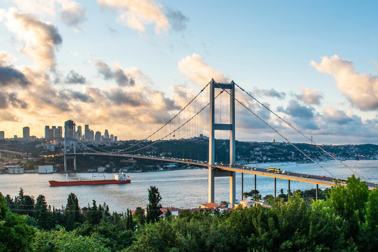A panoramic view of Istanbul 15 July Martyrs Bridge on sunset, Türkiye. (Adobe Stock Photo)