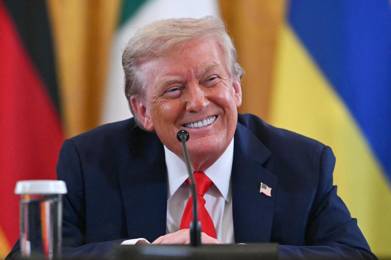 US President Donald Trump smiles during a meeting with Ukrainian President Volodymyr Zelensky and European leaders in the East Room of the White House in Washington, DC, on August 18, 2025. (AFP Photo)