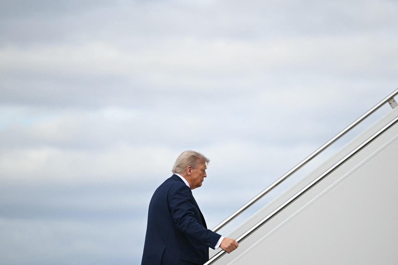 US President Donald Trump boards Air Force One before departing Joint Base Elmendorf-Richardson in Anchorage, Alaska on August 15, 2025. (AFP Photo)