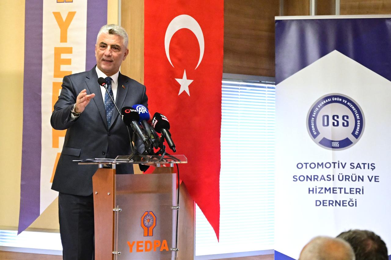 Türkiye's Trade Minister Omer Bolat speaking with automotive sector representatives at YEDPA Trade Center in Istanbul on 18 August, 2025. (AA Photo)