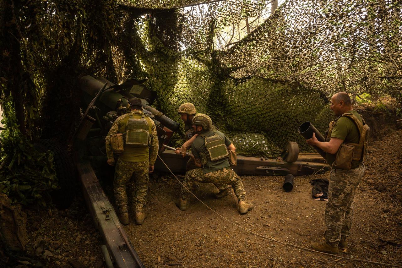 Ukrainian artillery squad awaits orders on the left bank of the Dnipro River in Kherson, Ukraine on August 11, 2025. (AA Photo)