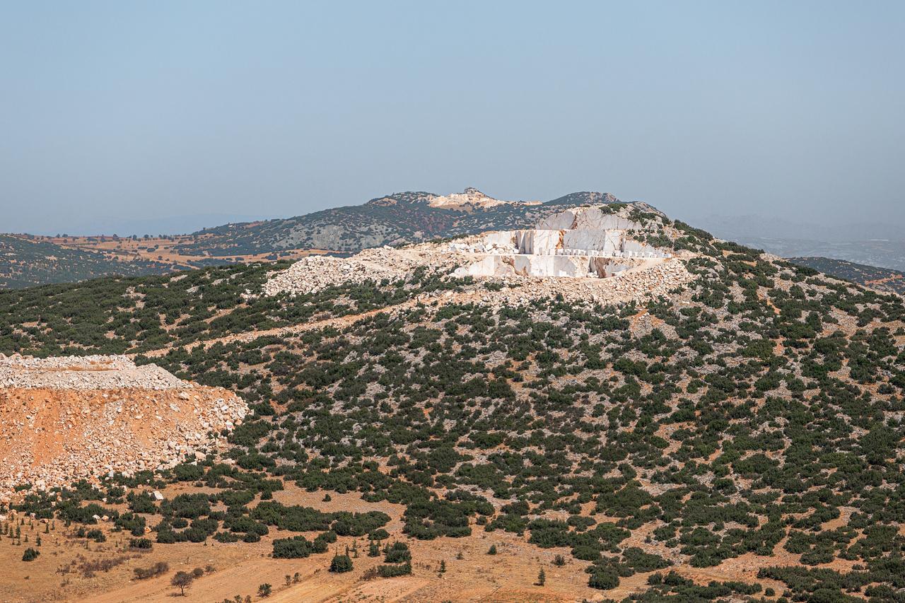 Aerial view of a marble quarry on a hillside in southwestern Türkiye. (Adobe Stock Photo)