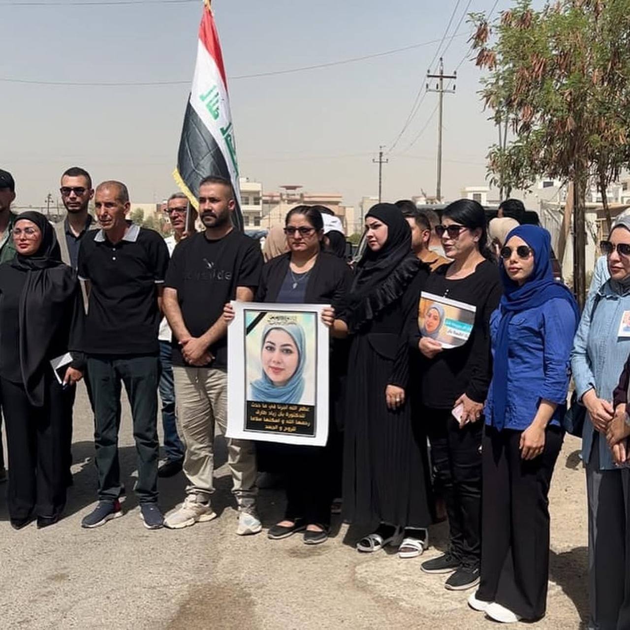 Protesests holding picture of Dr. Ban  Ziyad during a protest demanding a fair investigation into her death. (Photo by @afadedrose)