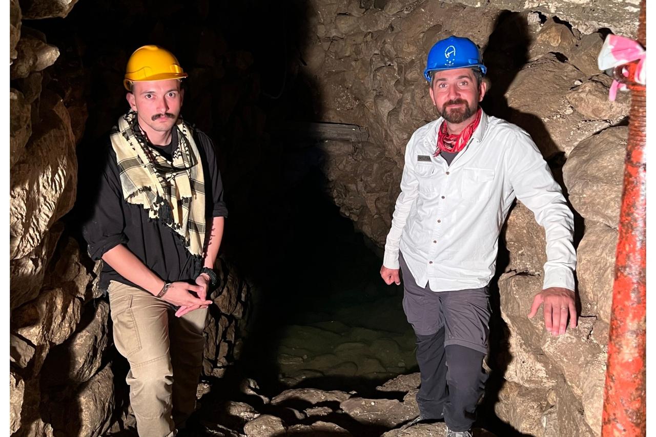 Deputy Head of Oymaagac Hoyuk Excavation associate professor Mehmet Ali Yilmaz (R), and Koray Erdogan from Türkiye Today (L) at the sacred spring in Nerik, Samsun, Türkiye, 2023. (Photo via Koray Erdogan/Türkiye Today)