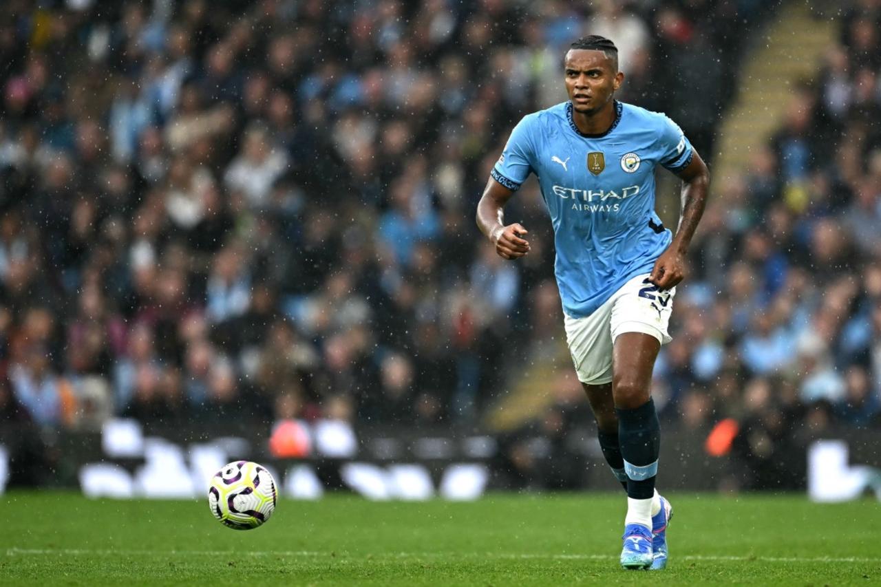 Manchester Citys Swiss defender Manuel Akanji runs with the ball during the English Premier League football match between Manchester City and Arsenal at the Etihad Stadium in Manchester, north west England, on Sept. 22, 2024. (AFP Photo)