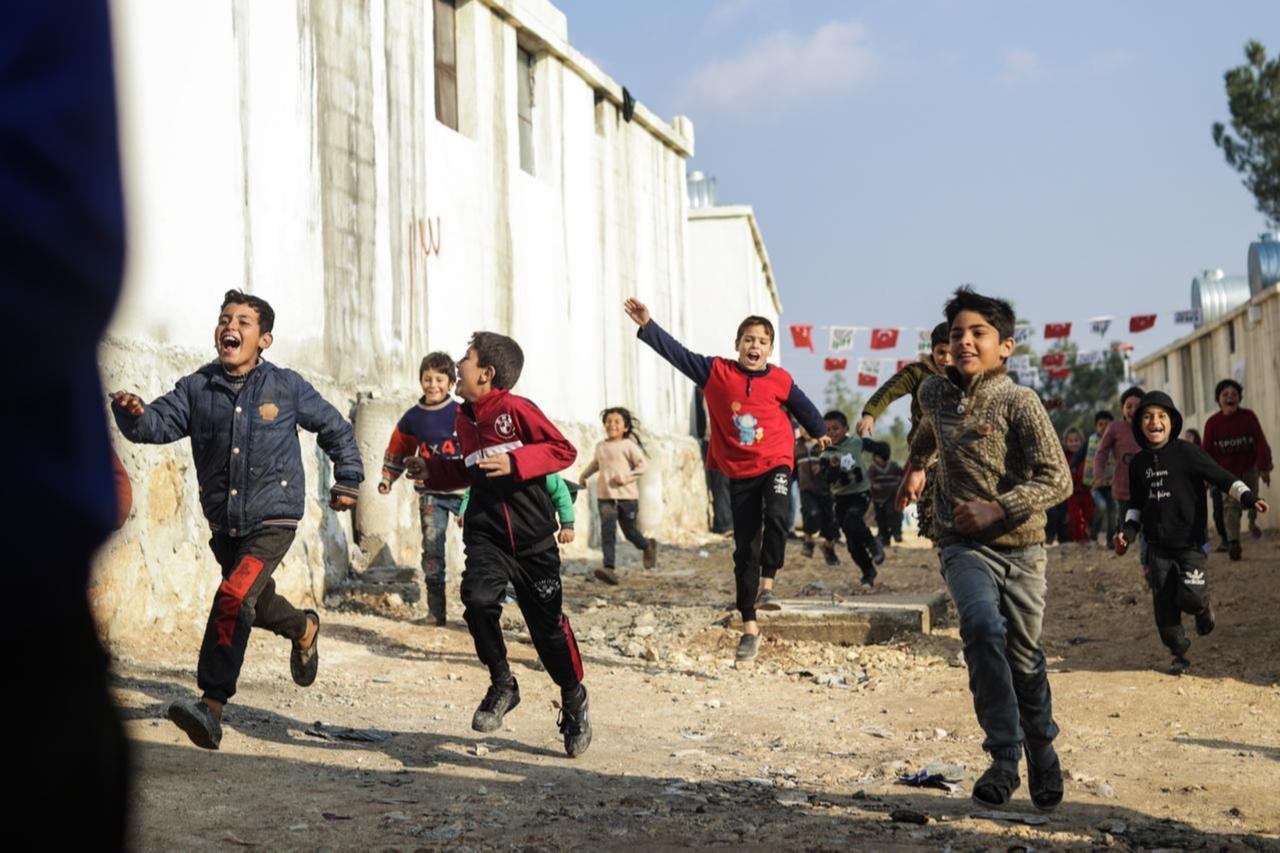 Children play among the briquette houses, delivered to their families by Human Movie Team and IHH Humanitarian Relief Foundation in Sharran town of Afrin district in Aleppo, which was cleared of the terrorist organization PKK, listed as a terrorist organization by Turkiye, US and EU, and the YPG, which Türkiye regards as a terror group as a result of Operation Olive Branch, January 7, 2023.