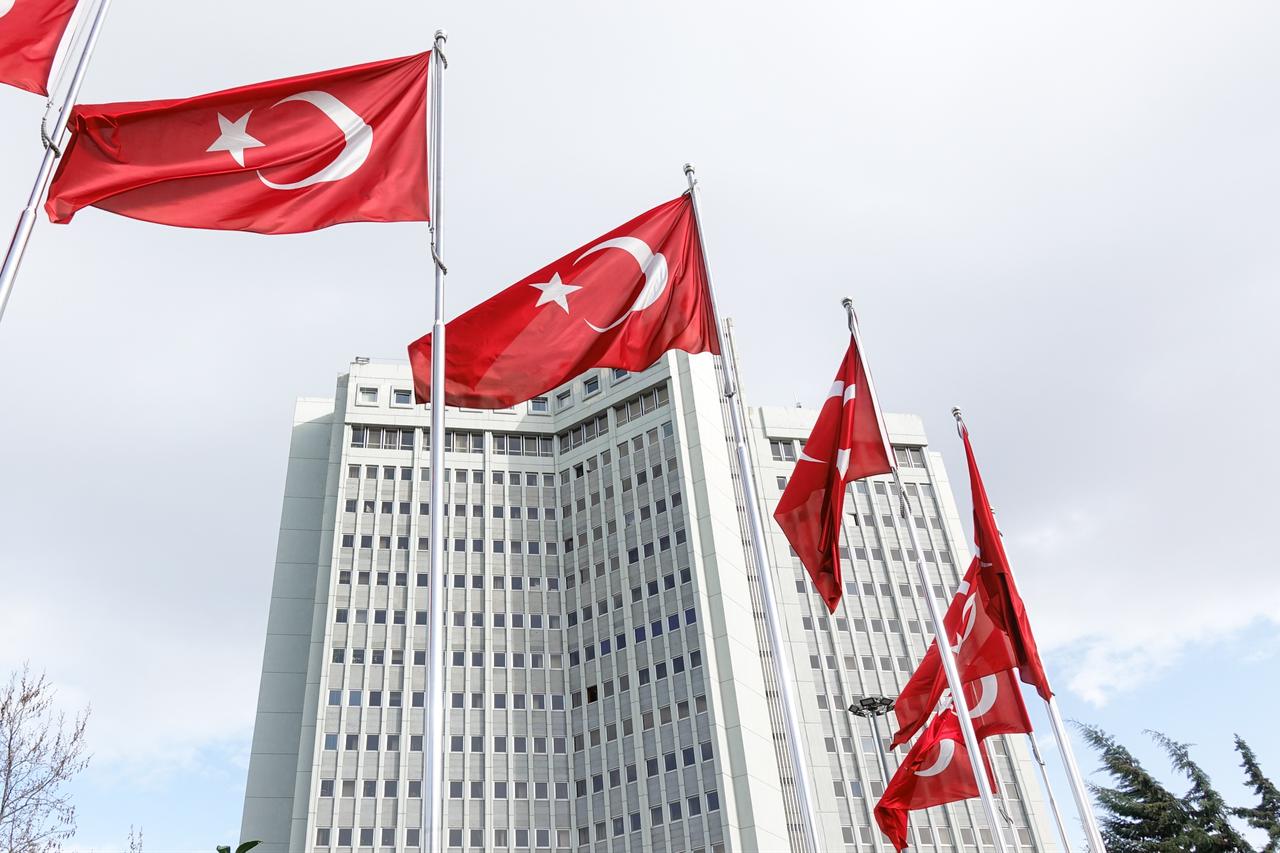 Turkish national flags hanging over the Ministry of Foreign Affairs Building in  Ankara, Türkiye. (Adobe Stock Photo)