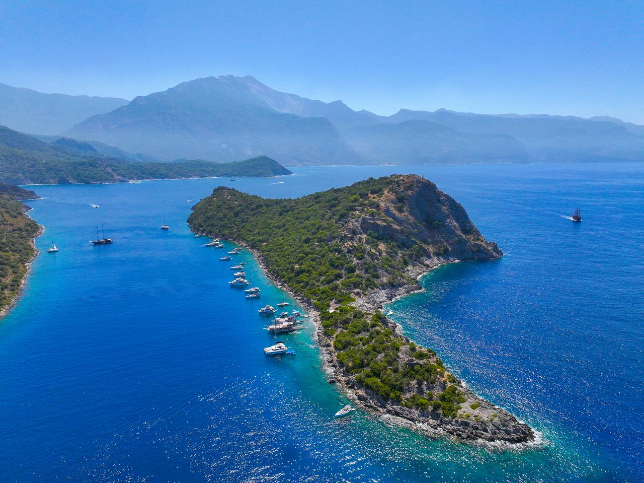Yachts off the coast of Fethiye district of Mugla, Türkiye on July 2025. (AA Photo)