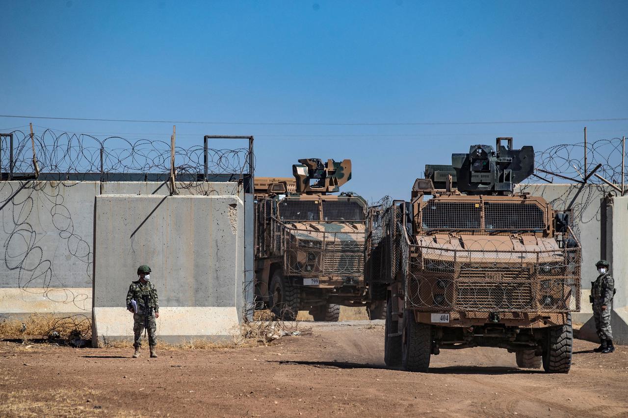 Turkish military vehicles enter Syria to take part in a joint patrol with Russian troops, in Syrias northeastern al-Hasakah province on July 14, 2021. (AFP Photo)