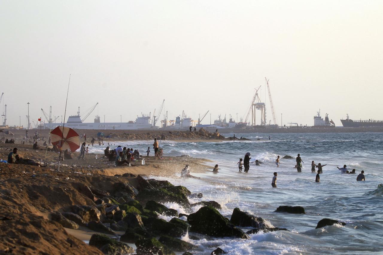People swim on a hot day in the Mediterranean sea in Libya's eastern coastal city of Benghazi on August 13, 2025. (AFP Photo)