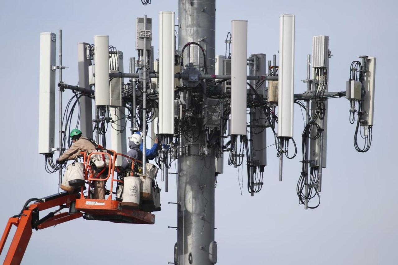 A technician works on the maintenance of a base station.