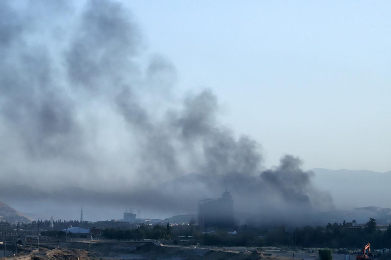 Smoke billows over a neighbourhood of Sulaymaniyah, after security forces arrested opposition figure Lahur Sheikh Jangi, following several hours of armed clashes on August 22, 2025. (AFP Photo)