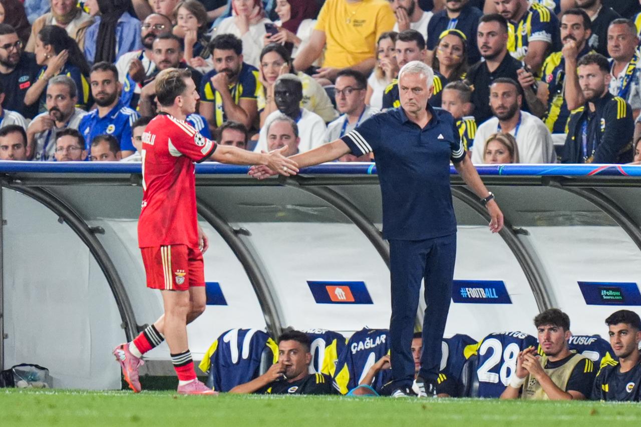 Head coach Jose Mourinho of Fenerbahce congratulates Kerem Akturkoglu of Benfica during the UEFA Champions League play-off round match between Fenerbahce and Benfica, at Chobani Stadium in Istanbul, Türkiye, August 20, 2025. (AA Photo)
