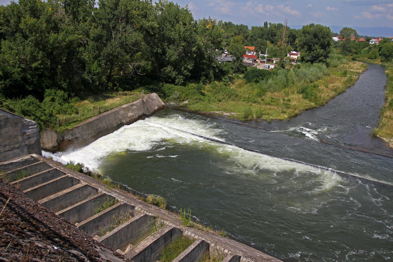 Overflow of the Iskar Dam, showcasing the release of excess water from the reservoir, Bulgaria. (Adobe Stock Photo)