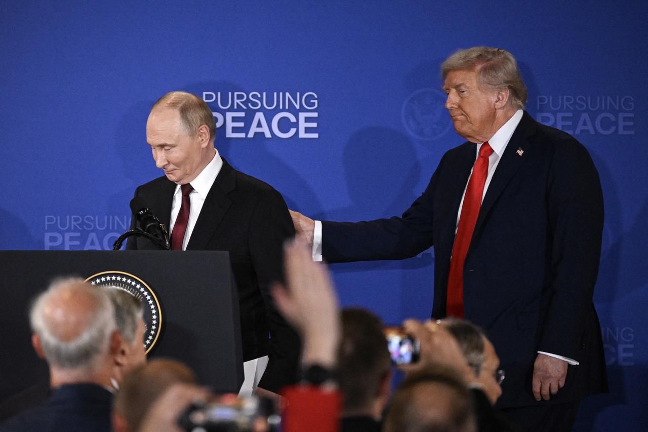 US President Donald Trump (R) and Russian President Vladimir Putin walk away after delivering a joint press conference in Anchorage, Alaska, on August 15, 2025. (AFP Photo)