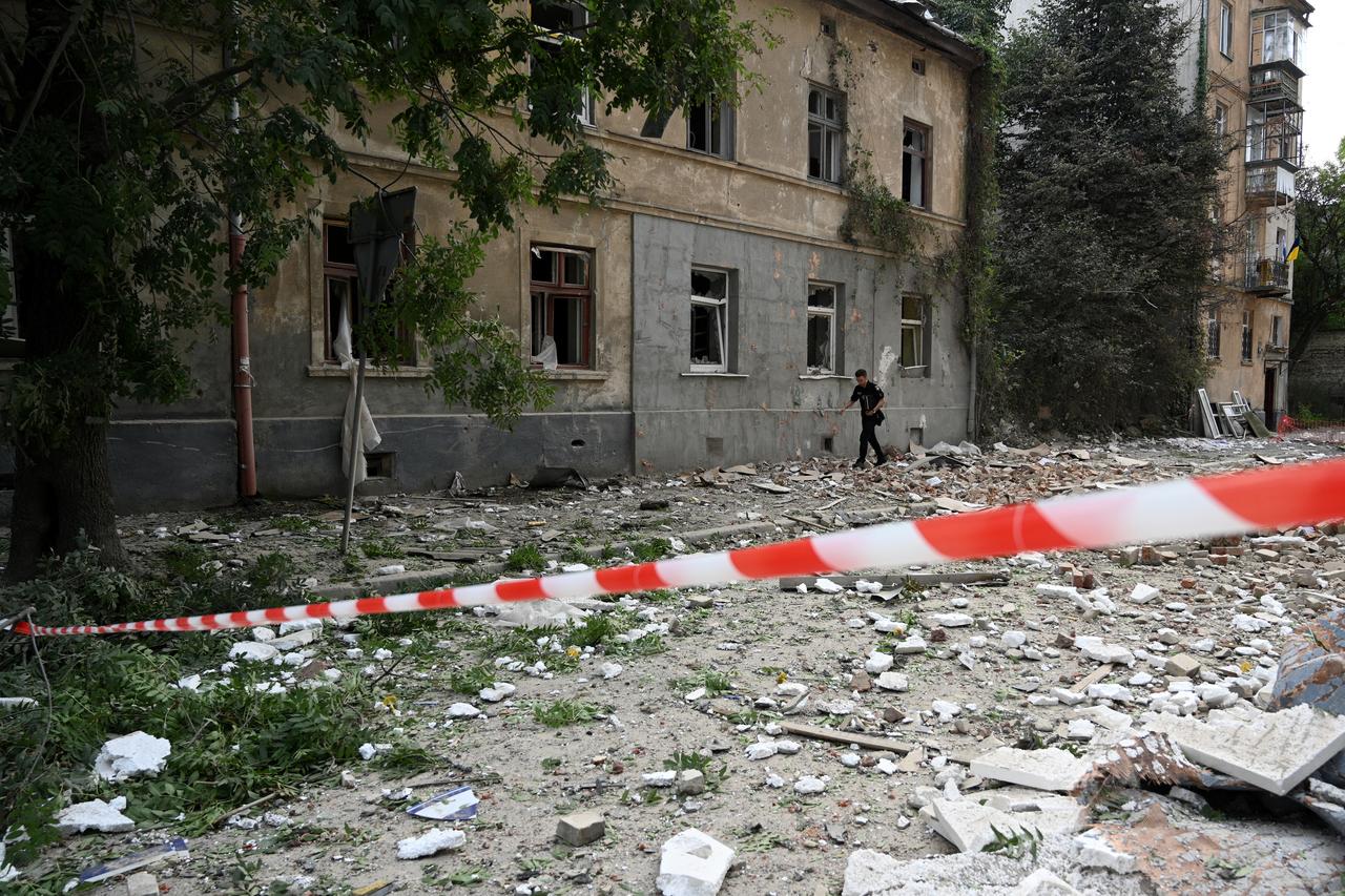 A man walks past a residential building damaged following Russian air attacks in the western Ukrainian city of Lviv on August 21, 2025. (AFP Photo)