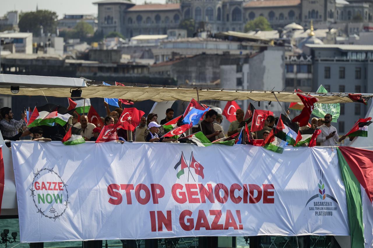 People participate at the "Open Rafah" movement’s event to show their solidarity with Gaza as they arrive near the Maiden’s Tower off the coast of Uskudar by boats departing from Karakoy, to gather at the Bosphorus in Istanbul, Türkiye, on August 23, 2025. (AA Photo)