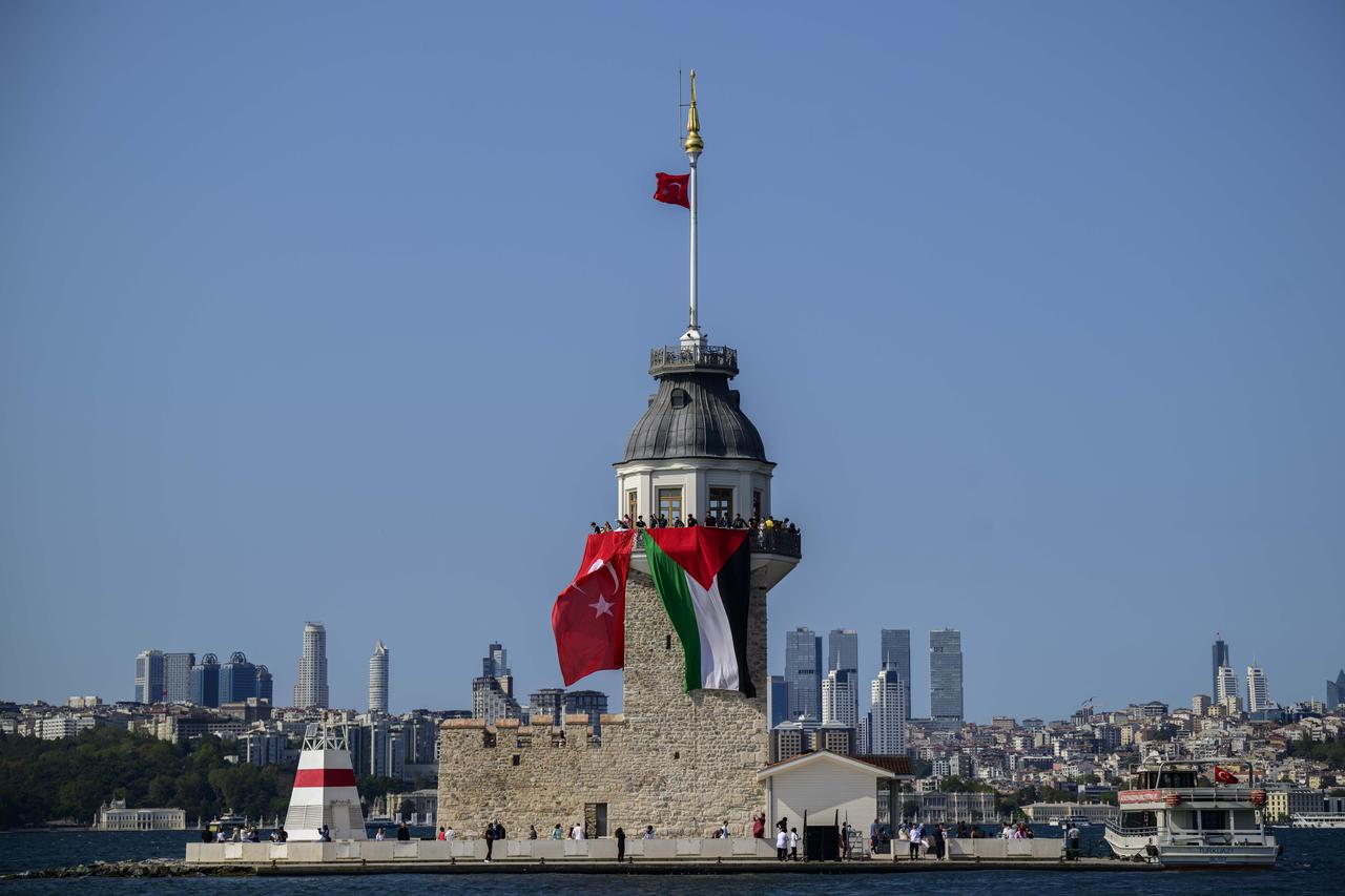 People participate at the "Open Rafah" movement’s event to show their solidarity with Gaza as they arrive near the Maiden’s Tower off the coast of Uskudar by boats departing from Karakoy, to gather at the Bosphorus in Istanbul, Türkiye, on August 23, 2025. (AA Photo)