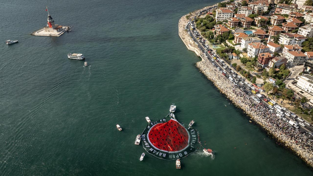An aerial view of watermelon banner, symbol of Palestinian resistance, at sea off the Maiden's Tower on the Uskudar coast during a pro-Palestinian event organized by the Open Rafah Movement in Istanbul, Türkiye on August 23, 2025. (AA Photo)