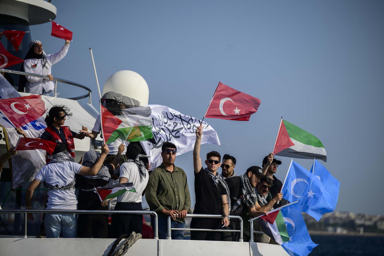 People participate at the "Open Rafah" movement’s event to show their solidarity with Gaza as they arrive near the Maiden’s Tower off the coast of Uskudar by boats departing from Karakoy, to gather at the Bosphorus in Istanbul, Türkiye, on August 23, 2025. (AA Photo)