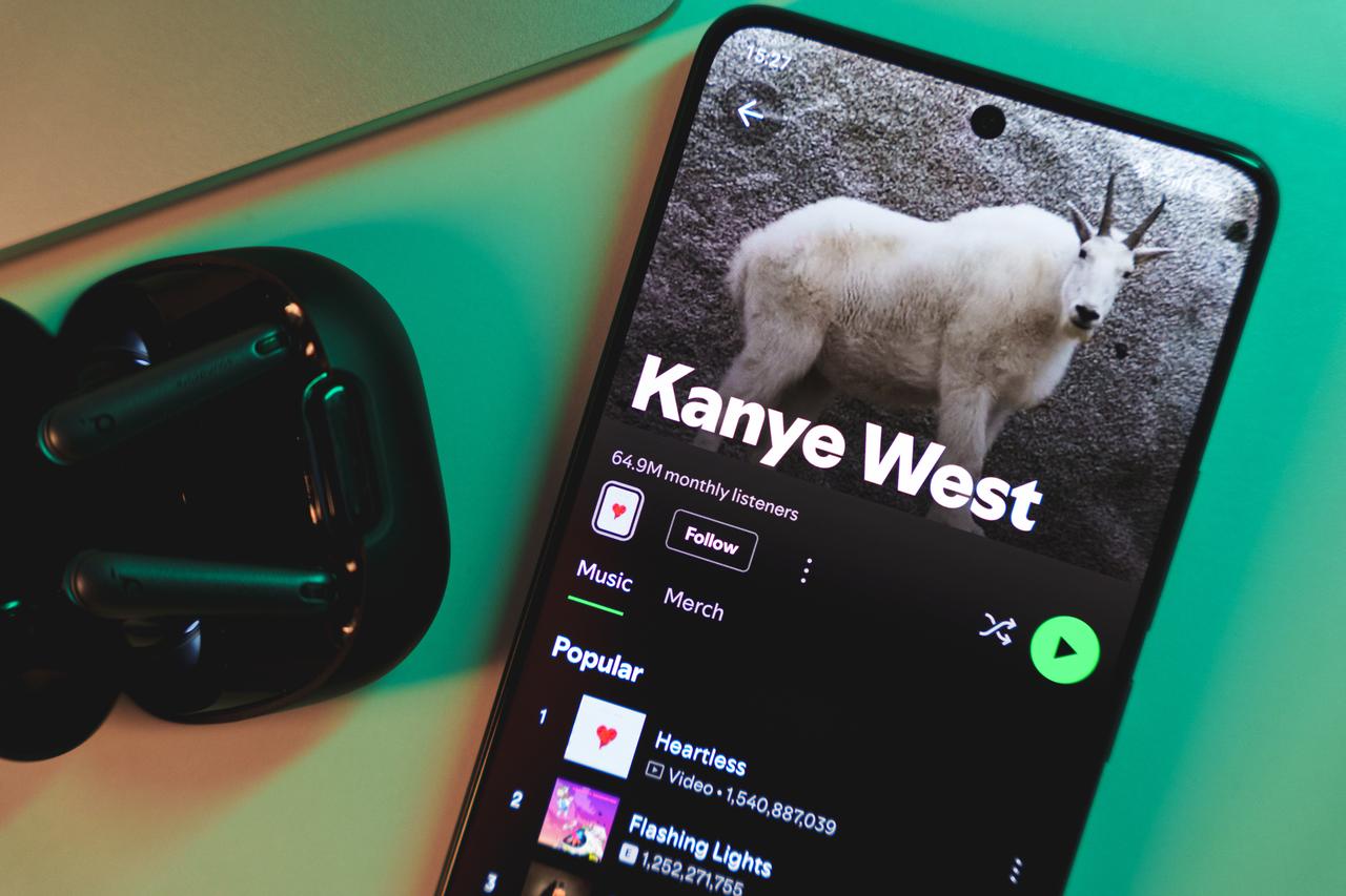 Kanye West’s artist profile displayed on a smartphone screen (Adobe Stock Photo)