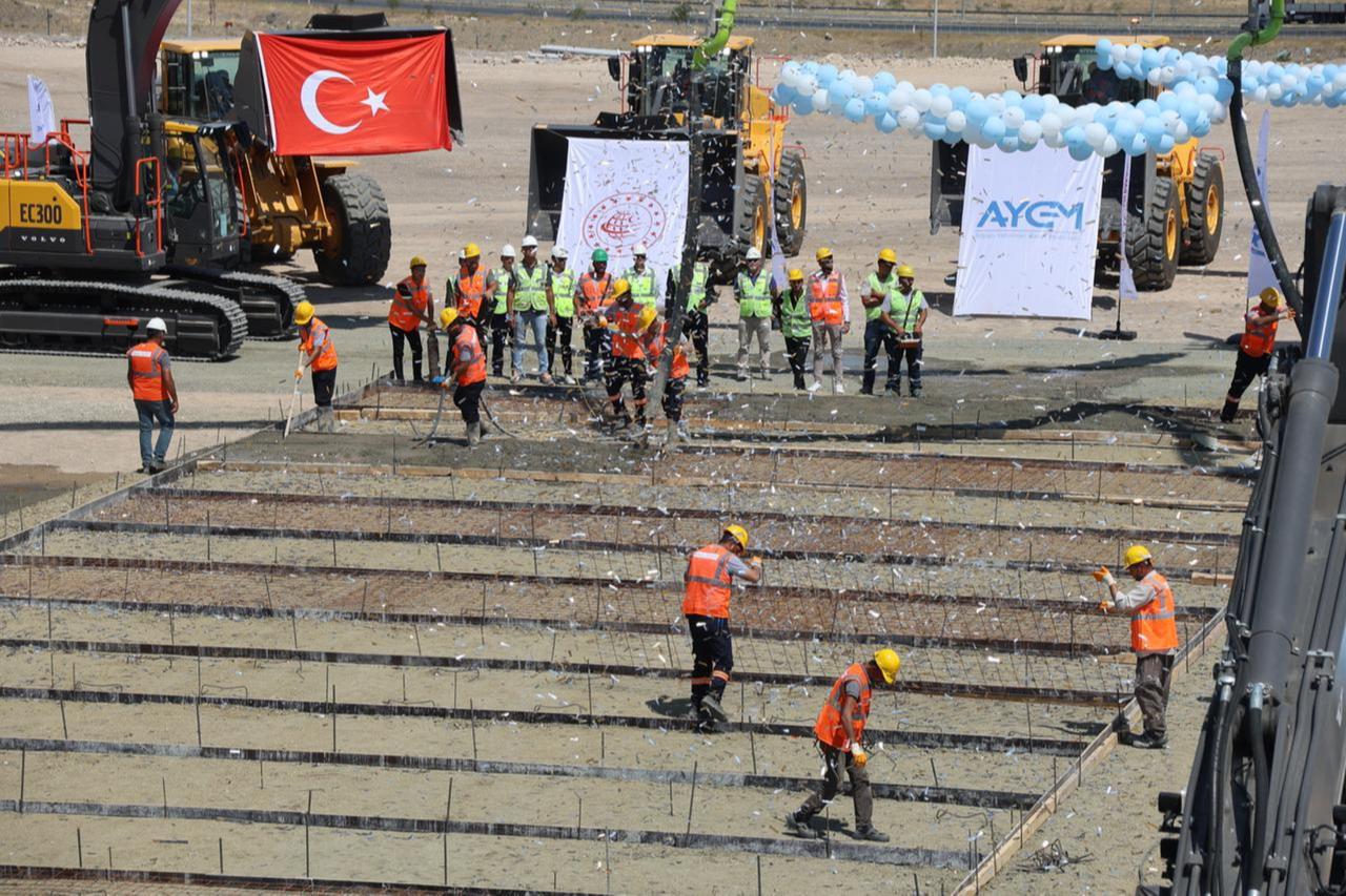 Workers lay the foundation during the groundbreaking ceremony of the Kars–Igdir–Aralik–Dilucu Railway Line project in Igdir, Türkiye, accessed on August 23, 2025. (AA Photo)