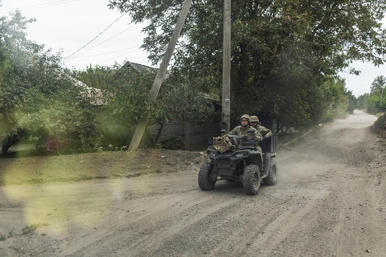 Ukrainian soldiers on a quad bike on a street in Kostiantynivka, Ukraine, 23 August 2025. (AA Photo)